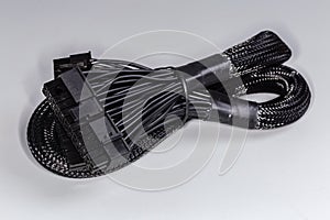 Power cable of modular computer power supply in braided sleeving