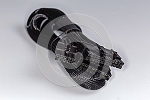 Power cable of modular computer power supply in braided sleeving