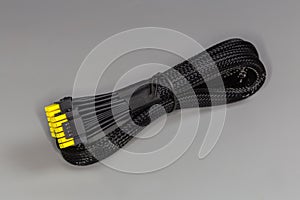 Power cable of modular computer power supply in braided sleeving