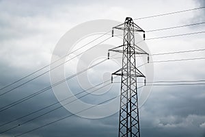 Power cable tower on cloudy day