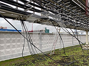 Power cables and instrument cables in the trays .Electric cables lying in metal cable trays.Cable tray and Cable ladder on Pipe