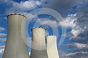 power cooling towers under cloudy sky