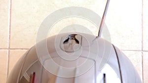 Power cord retracts into the vacuum cleaner