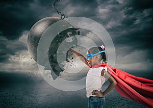 Power and determination of a super hero child against a wrecking ball