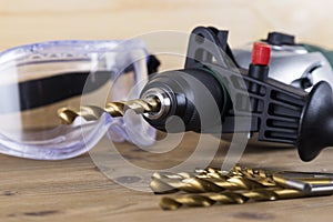 Power Drill with Bits and Goggles