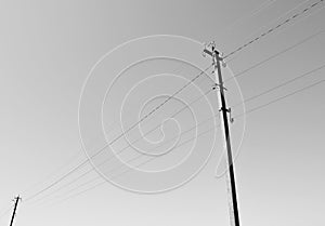 Power electric pole with line wire on background close up