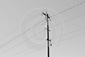 Power electric pole with line wire on background close up