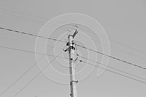 Power electric pole with line wire on background close up