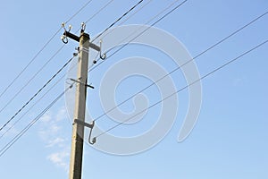 Power electric pole with line wire on colored background close up