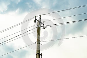 Power electric pole with line wire on colored background close up