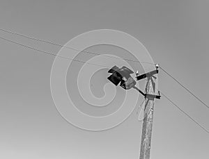 Power electric pole with line wire on light background close up