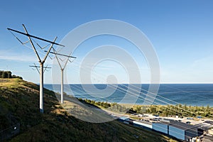 Power Electrical Lines From Hydro Electric Plant on Hill Meeting Water