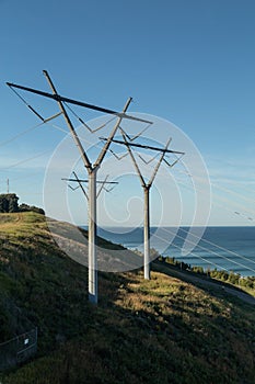 Power Electrical Lines From Hydro Electric Plant on Hill Meeting Water