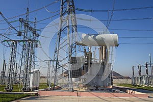 Power electrical substation with high voltage equipments. Electric high voltage station. Power lines and transformer