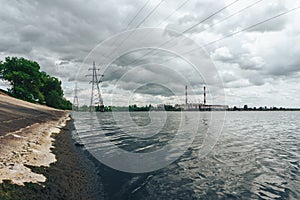 Power electricity station or factory with pipes on a river In Voronezh