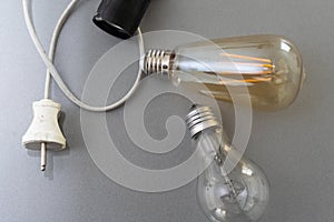 Power energy saving concept. light bulb with light on on gray background.