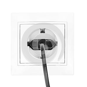 Power European electric plug isolated on a white. black electric cord plugged into a white electricity socket on white background