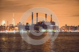 Power generation plant in New York City at night time on river bank