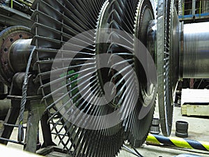 Power generator steam turbine in repair process, machinery, pipes, tubes at power plant