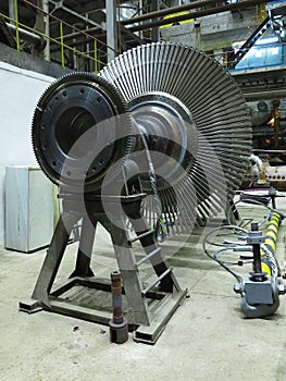 Power generator steam turbine in repair process, machinery, pipes, tubes at power plant