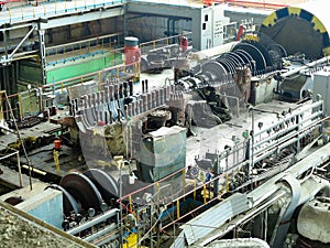 Power generator steam turbine in repair process, machinery, pipes, tubes at power plant