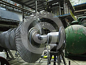 Power generator steam turbine in repair process, machinery, pipes, tubes at power plant