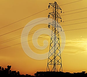 Power grid and transsmission liness and polluted sky during sunset