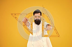 Power knowledge. Bearded nerd triangle. Smart student. Geometry teacher. Student using measuring instrument. Engineering