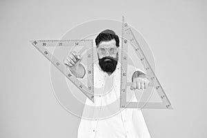 Power knowledge. Bearded nerd triangle. Smart student. Geometry teacher. Student using measuring instrument. Engineering