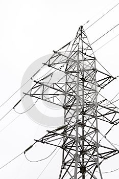 Power line against the background of bright sky