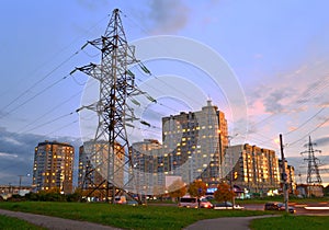 Power line feeding the evening city.