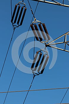 Power line insulators on a blue sky