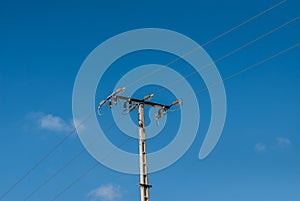 Power line pole with blue sky blue electricity concept texture and background.
