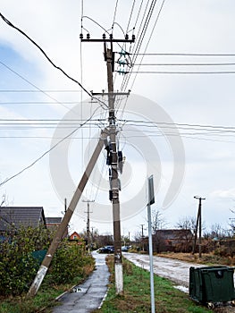 power line pole with lot of wires in village