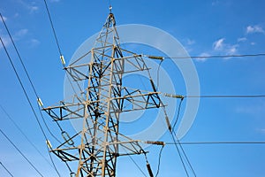 power line support with wires for electricity transmission. High voltage grid tower with wire cable at distribution station.