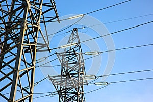 power line support with wires for electricity transmission. High voltage grid tower with wire cable at distribution station.