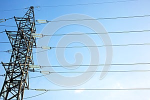 power line support with wires for electricity transmission. High voltage grid tower with wire cable at distribution station.