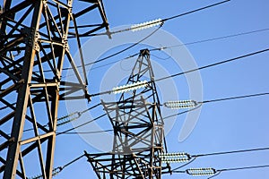 power line support with wires for electricity transmission. High voltage grid tower with wire cable at distribution station.