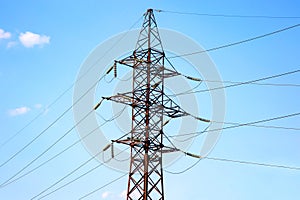 power line support with wires for electricity transmission. High voltage grid tower with wire cable at distribution station.