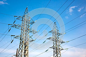 power line support with wires for electricity transmission. High voltage grid tower with wire cable at distribution station.