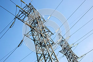 power line support with wires for electricity transmission. High voltage grid tower with wire cable at distribution station.