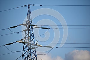 Power line tower against the blue sky