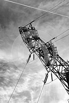 Power line tower against the cloudy sky