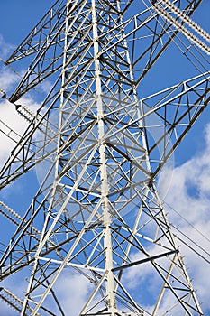 Power line tower. Energy industry. Industrial electricity distribution. Renewable production