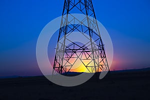 Power line tower and sunrise