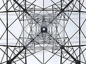 Power line tower viewed from above. Geometrical structure. Energy distribution