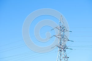 Power line towers against of the blue sky