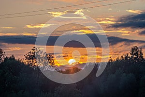 Power line wires on sunset background