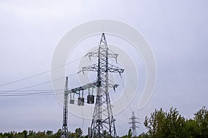 Power lines against the background of a gloomy sky. The concept of energy security.