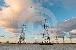 Power lines during a beautiful winter sunset